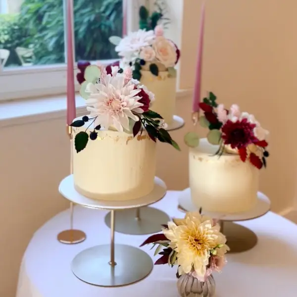 Celebration cakes with fresh flowers on display